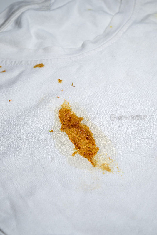 Stained clothes of chilli pepper sauce on white T-Shirt